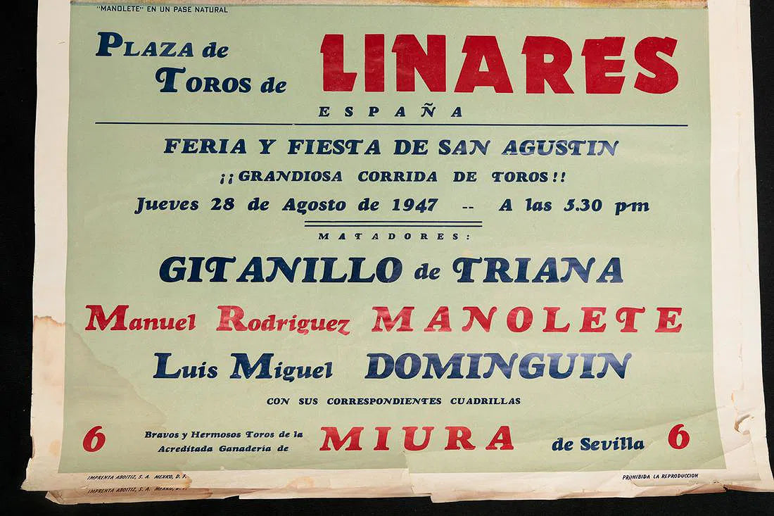 Linares poster lettering naming Manolete, Gitanillo de Triana, and Dominguín, with staining, tears, and paper loss along the margins.