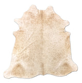 Beige cowhide rug on a white background