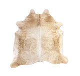 brown white cowhide rug