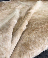 brown white cowhide rug