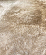 brown white cowhide rug