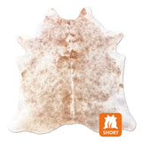brown white cowhide rug
