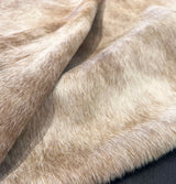 Close-up of beige cowhide rug