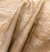 beige cowhide rug