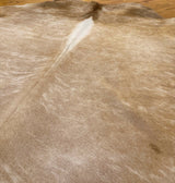 beige cowhide rug