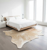 Beige cowhide rug on a white background