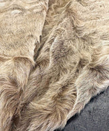Close-up of a textured fur surface with a neutral color palette.