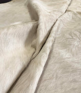 white cowhide rug