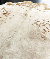 brown white cowhide rug