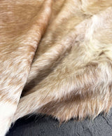 shaggy brown cowhide rug