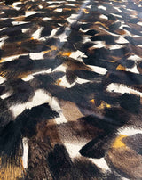 stenciled black cowhide rug
