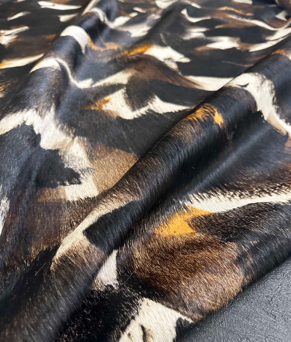 stenciled black cowhide rug