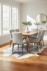 stenciled zebra cowhide rug under a table on wood floor