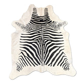 Zebra print cowhide rug on a white background