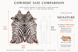 A size comparison infographic for a furug cowhide rug. It shows a real zebra-patterned cowhide rug on the left with dimension labels for 7'6" length and 5'6" width, next to a white human silhouette labeled 5'10" scale reference.