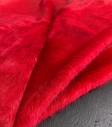 red cowhide rug