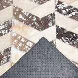 Palermo stitched cowhide sample with a corner turned back to show gray felt backing and small black rubber grip dots.