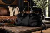 black cowhide duffle bag