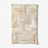 Enchanté 16-by-24-inch stitched cowhide rug sample in tonal ivory and warm cream with an interlocking I-and-H pattern