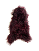 red sheepskin rug