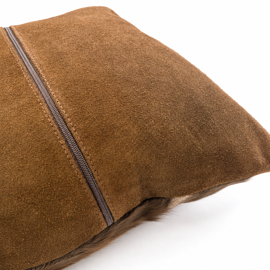 Genuine cognac brown suede backing and zipper detail on springbok hide pillow