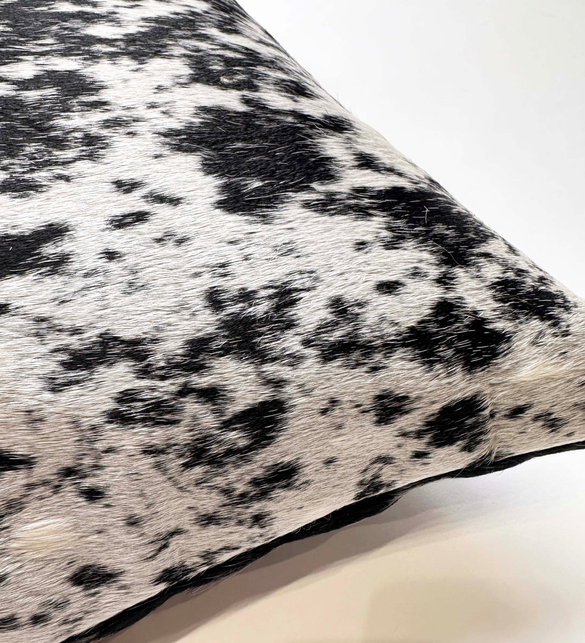 Close-up of natural salt and pepper cowhide showing black and white markings