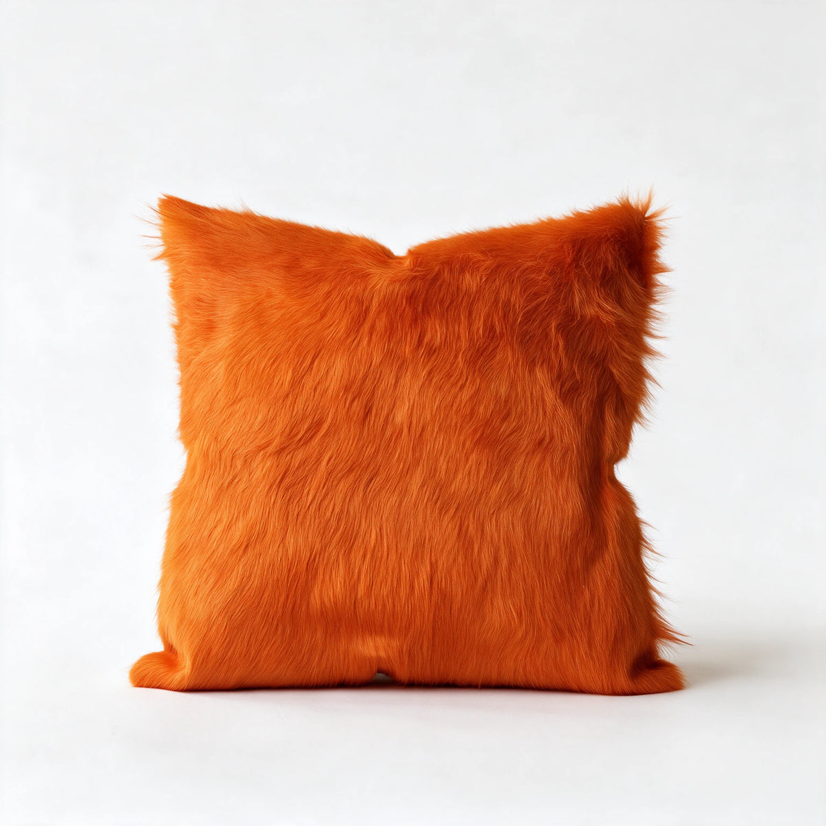 Valencia orange cowhide pillow in 20 x 20 square size