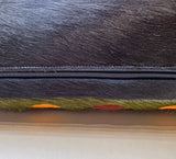 Snake stitched cowhide pillow detail showing hidden zipper and cowhide back