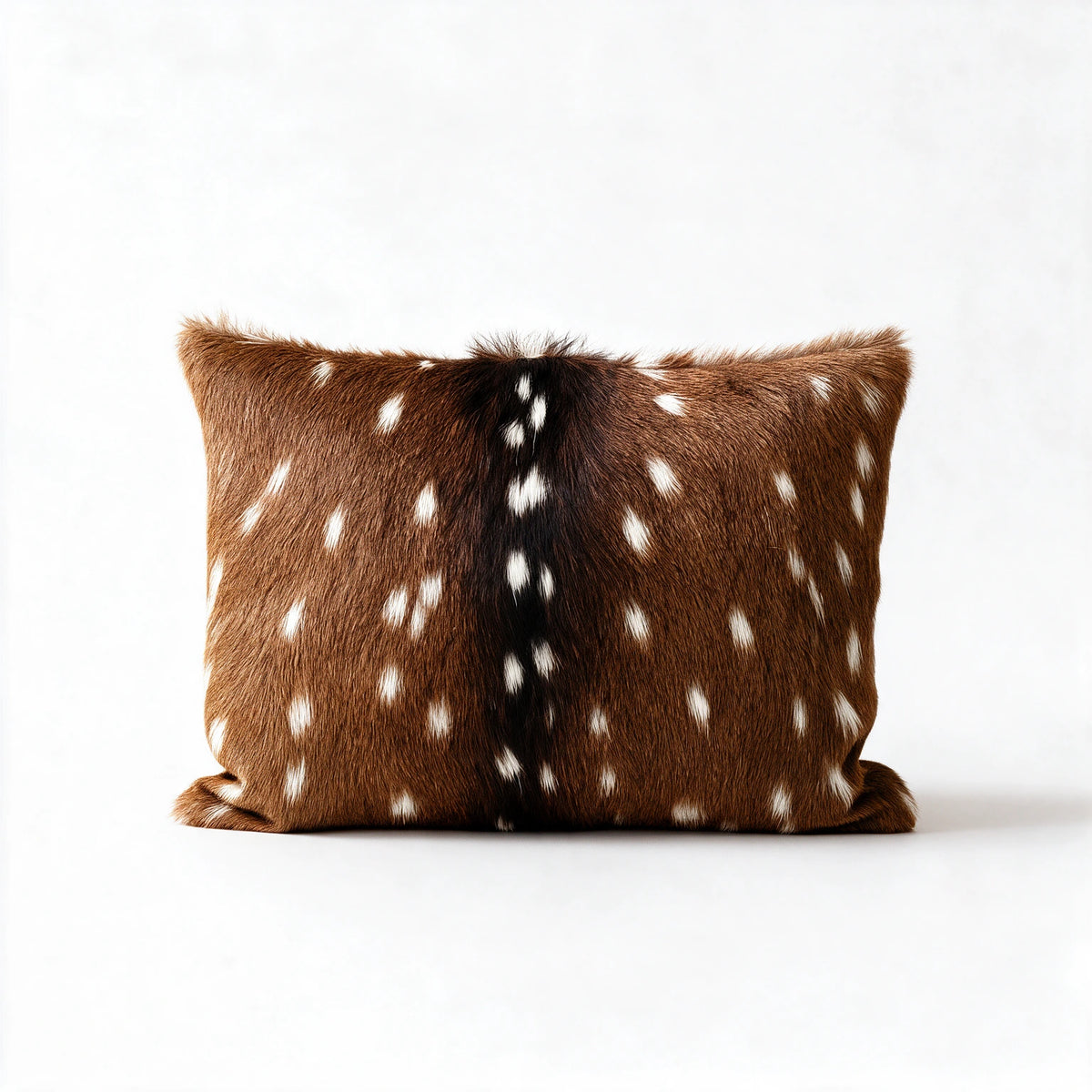 Axis deer hide pillow with natural chestnut brown and white spotted markings