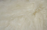 white sheepskin fur rug