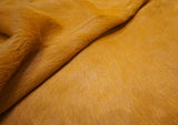 dyed Hermes orange cowhide rug