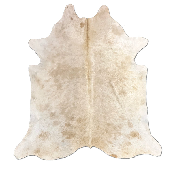 Beige cowhide rug on a white background