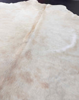 Close-up of a cowhide rug with natural patterns and colors.