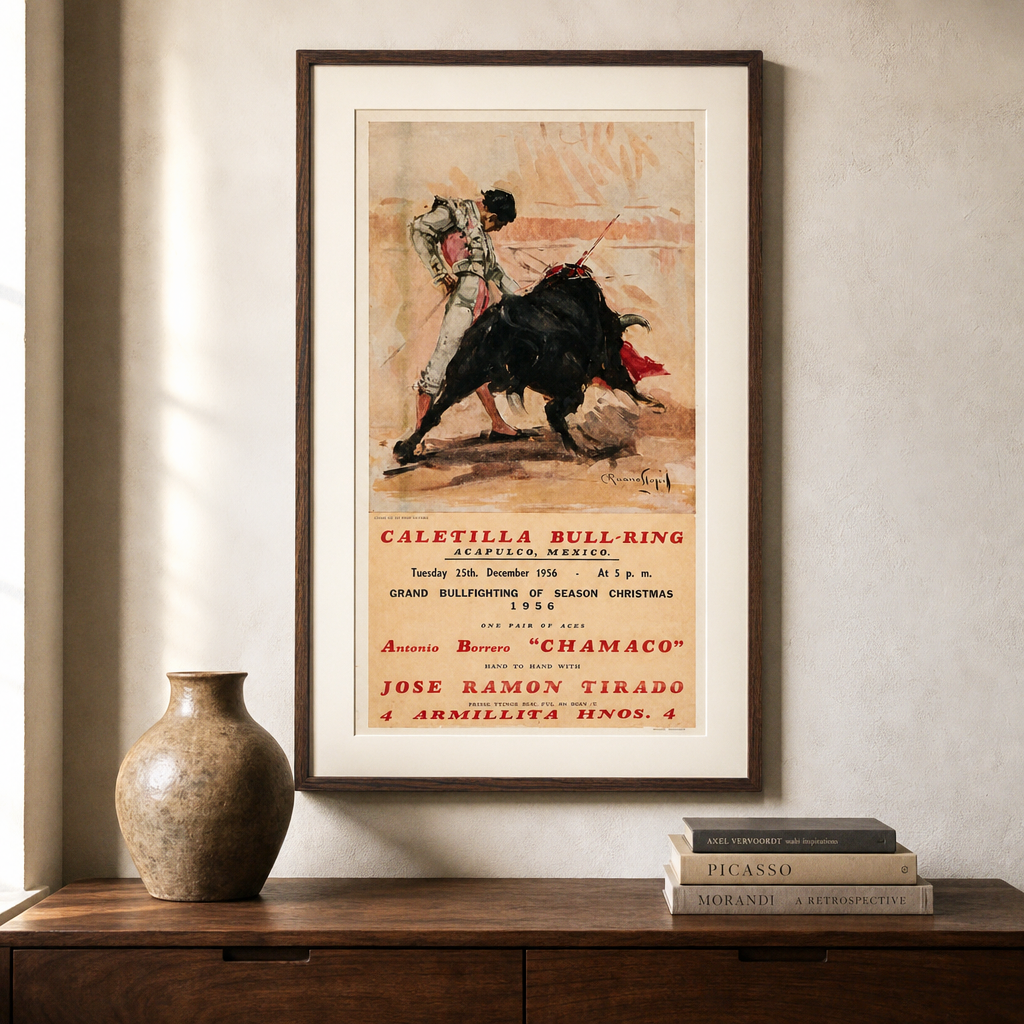 Caletilla bullfighting poster shown in a dark wood frame above a walnut console; framing shown for styling only.