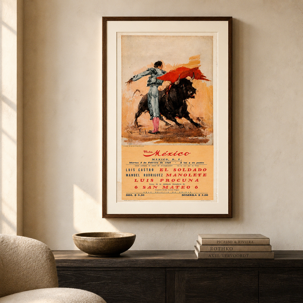 Plaza México poster displayed in a walnut frame above a charcoal console beside a cream chair; framing for illustration only.