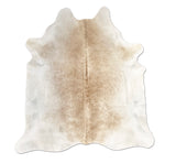 Cowhide rug with a natural pattern on a white background