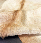 Close-up of a cowhide fur surface with a natural pattern