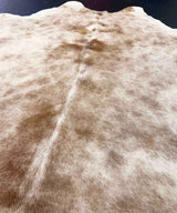 Close-up of a cowhide rug with brown and beige pattern