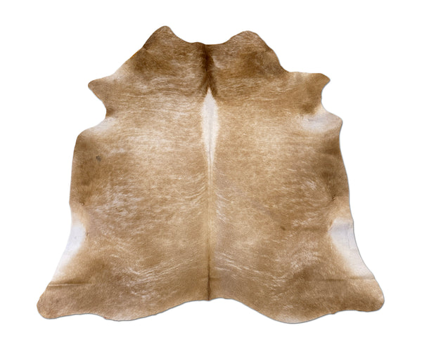 beige cowhide rug