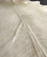 beige cowhide rug