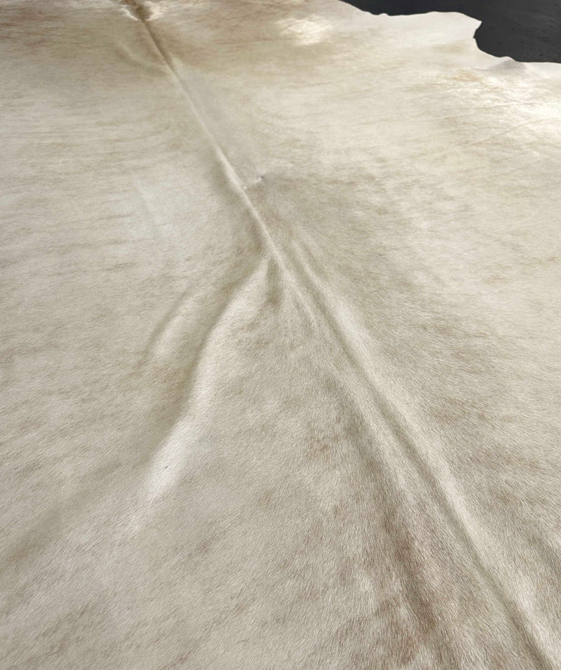 beige cowhide rug