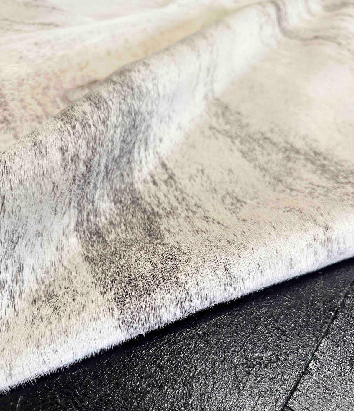 close-up of a gray brindle cowhide rug