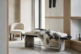 Natural gray Icelandic sheepskin styled on a luxury contemporary bench