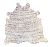 Cowhide rug with a glittery texture on a white background