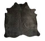 Black crocodile skin hide on a white background