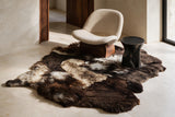 Brown and black multi-pelt Icelandic sheepskin rug in a luxury contemporary interior