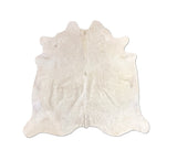 white cowhide rug
