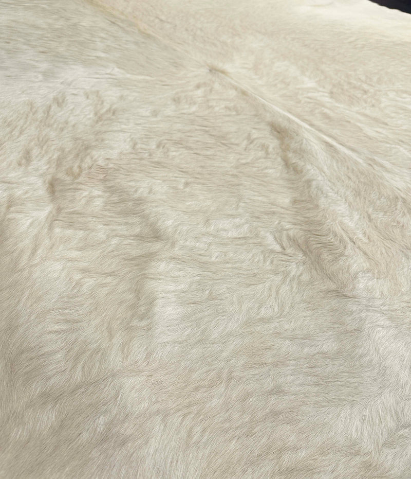 white cowhide rug