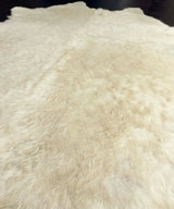 white cowhide rug