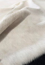 Close-up of white cowhide fur texture